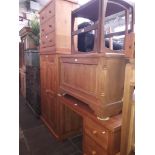 Various pieces of pine bedroom furniture; a chest of drawers, a wardrobe, a blanket box and a desk/
