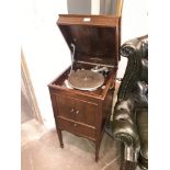 A 1920s Columbia oak cased gramophone with various 78s.