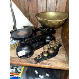 A set of Salter Staffordshire kitchen scales with a set of Brass Bell weights on a Tray