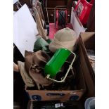 A box containing a desk lamp, a set of antlers and Headware, including a Pith Helmet, an Austrakian