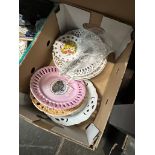 A box of early 20th Century ribbon plates