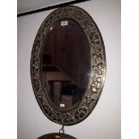 An Arts and Crafts brass framed mirror, 45cm x 66.5cm.