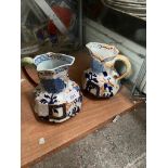 A matched pair of Davenport Imari stoneware jugs.