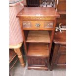 An Old Charm oak linen-fold cabinet.