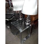 A chrome and glass nest of tables, two modern table lamps, a metal wine rack and a spare lamp shade.