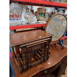 An oak nest of tables and an embroidered firescreen/ coffee table.