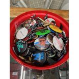 A tub of vintage badges