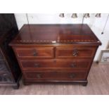 A late Victorian Aesthetic Movement inlaid walnut chest of drawers with Gothic style handles, by