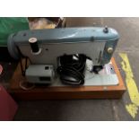 A cased Brother electric sewing machine with power lead and pedal etc