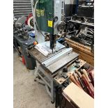 A Record Power BS300 bandsaw with accessories together with a workbench.
