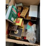 A box of games, playing cards, and dolls house furniture