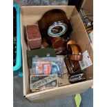 A box of assorted items including a Smiths mantle clock, razors, Art Deco bookends, cash tins etc.