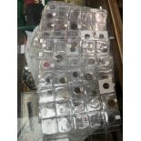13 plastic sheets containing coins of the world and tokens