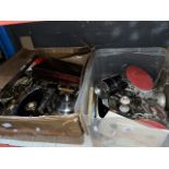 Two boxes of metalware to include a part canteen of cutlery, brassware, etc.