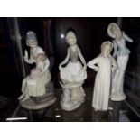 3 Lladro figures and 1 other.