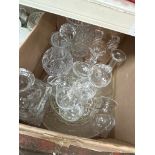 A box of glassware to include glass bowl, decanters, drinking glasses etc