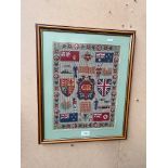 A George V wartime sampler 29cm x 38cm, glazed and framed.