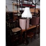 Various items of furniture; a pine dining table, an Ercol refectory table, a bench seat, a trolley.