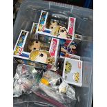 A box of POP! figures and Lego.