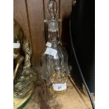 A glass decanter together witha late Victorian cut glass scent bottle decorated with a dog.