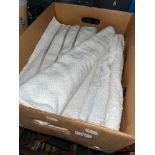 A box of cotton hand towels.