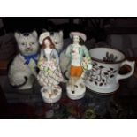 Assoorted 19th century Staffordshire pottery comprising a pair of cats, a twin handle mug and a pair