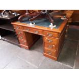 A late Victorian walnut pedestal desk with tooled leather top and presentation plaque for 1892.