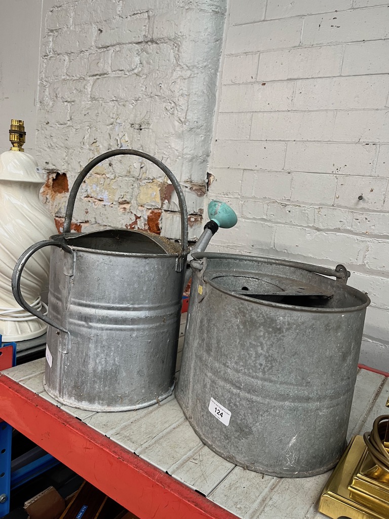 A galvanised mop bucket and a galvanised watering can.