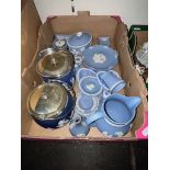 A box of blue and white Wedgewood jasperware including jug, clock, biscuit barrels, blindman's bluff