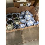 A box of mostly blue and white Wedgewood jasperware including four picture frames, vases, jugs etc.