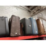 Five vintage suitcases and a Briefcase