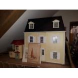 A doll's house together with a Sylvanian Familes doll's house, furniture and figures.