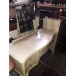 A vintage painted dressing table and matching chest of drawers.