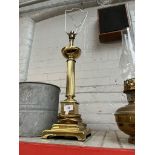A brass column table lamp.