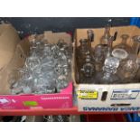 A box of decanters and a box of drinking glasses