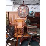 A Victorian mahogany pole screen with tapestry 'Spes Mea Veritas', My Hope is in Truth'.