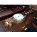 A mahogany cased banjo barometer with mercury thermometer.