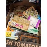 A box of ephemera including postcards, stamps leaflets etc