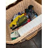 A wicker basket containing Matchbox, Triang, Corgi and Dinky toys