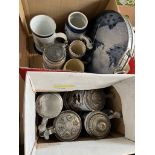 Two boxes of steins and tankards including Delph and a ceramic tray.