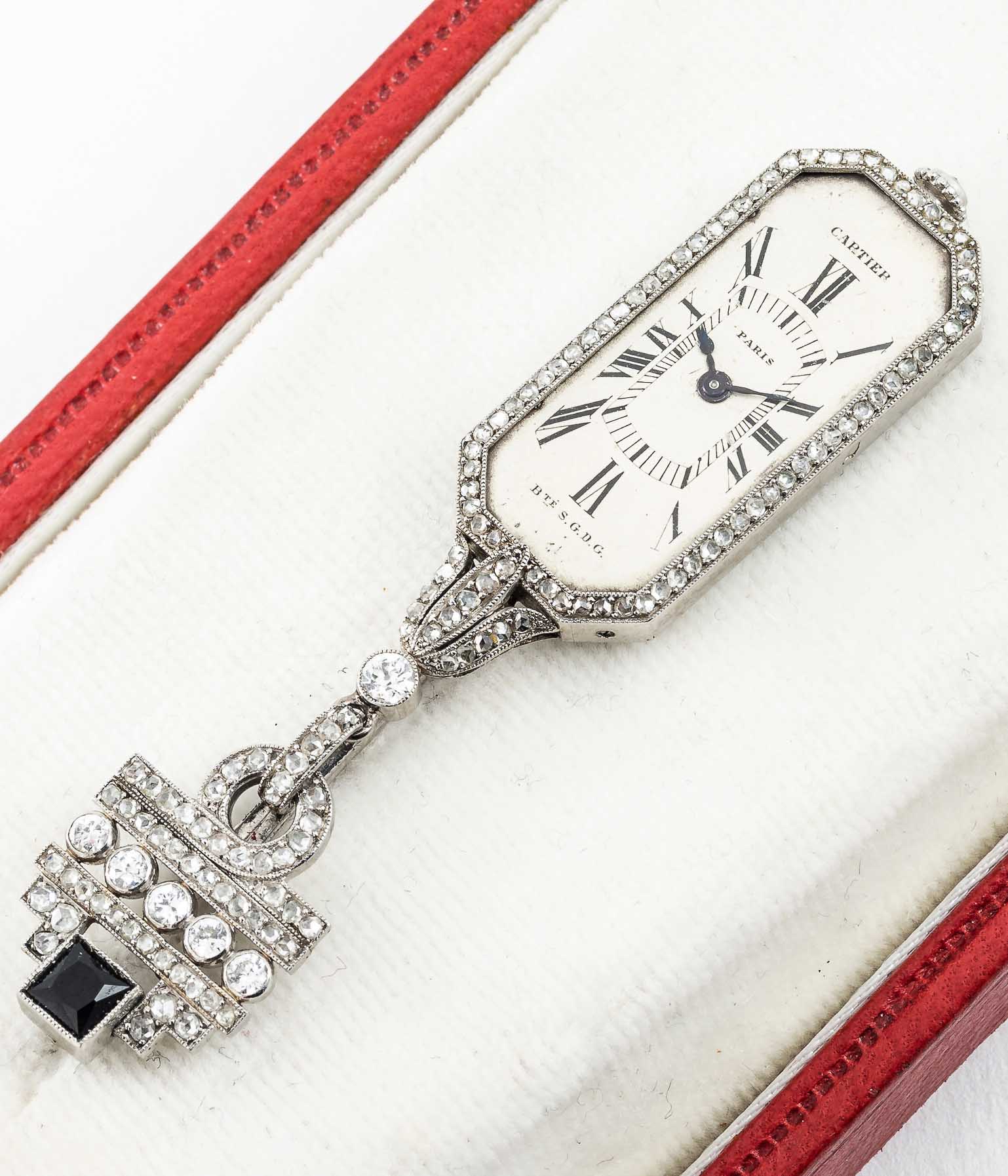 A FINE & RARE LADIES PLATINUM & ONYX CARTIER PARIS BTE S.G.D.G PENDANT WATCH CIRCA 1920s WITH