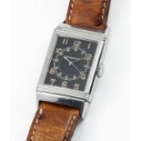 A RARE STAINLESS STEEL JAEGER LECOULTRE REVERSO WRIST WATCH CIRCA 1930s, WITH ORIGINAL BLACK