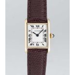 A LADIES 18K SOLID GOLD CARTIER PARIS TANK LOUIS MECANQIUE WRIST WATCH CIRCA 1980, REF. 67117