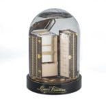 A LOUIS VUITTON NOVELTY WARDROBE TRUNK SNOW GLOBE GIVEN TO VIP CUSTOMERS & ACCOMPANIED BY ORIGINAL