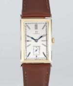 A GENTLEMAN'S 18K SOLID WHITE & YELLOW GOLD OMEGA RECTANGULAR WRIST WATCH CIRCA 1930 WITH "COIN