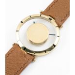 A RARE GENTLEMAN'S 18K SOLID GOLD CARTIER "MYSTERY" WRIST WATCH CIRCA 1950, WITH CARTIER SIGNED