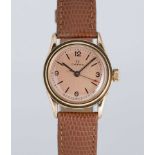 A GENTLEMAN'S SMALL SIZE 14K SOLID GOLD OMEGA WRIST WATCH CIRCA 1939, WITH SALMON DIAL Movement: