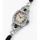 A FINE & RARE LADIES PLATINUM, DIAMOND & ONYX CARTIER COCKTAIL BRACELET WATCH CIRCA 1920s, WITH