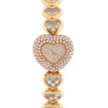 A FINE LADIES 18K SOLID YELLOW GOLD & DIAMOND CHOPARD HAPPY DIAMONDS BRACELET WATCH CIRCA 1990s,