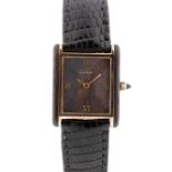 A RARE GENTLEMAN'S SIZE GOLD PLATED & WOOD CARTIER TANK WRIST WATCH CIRCA 1980 Movement: Manual